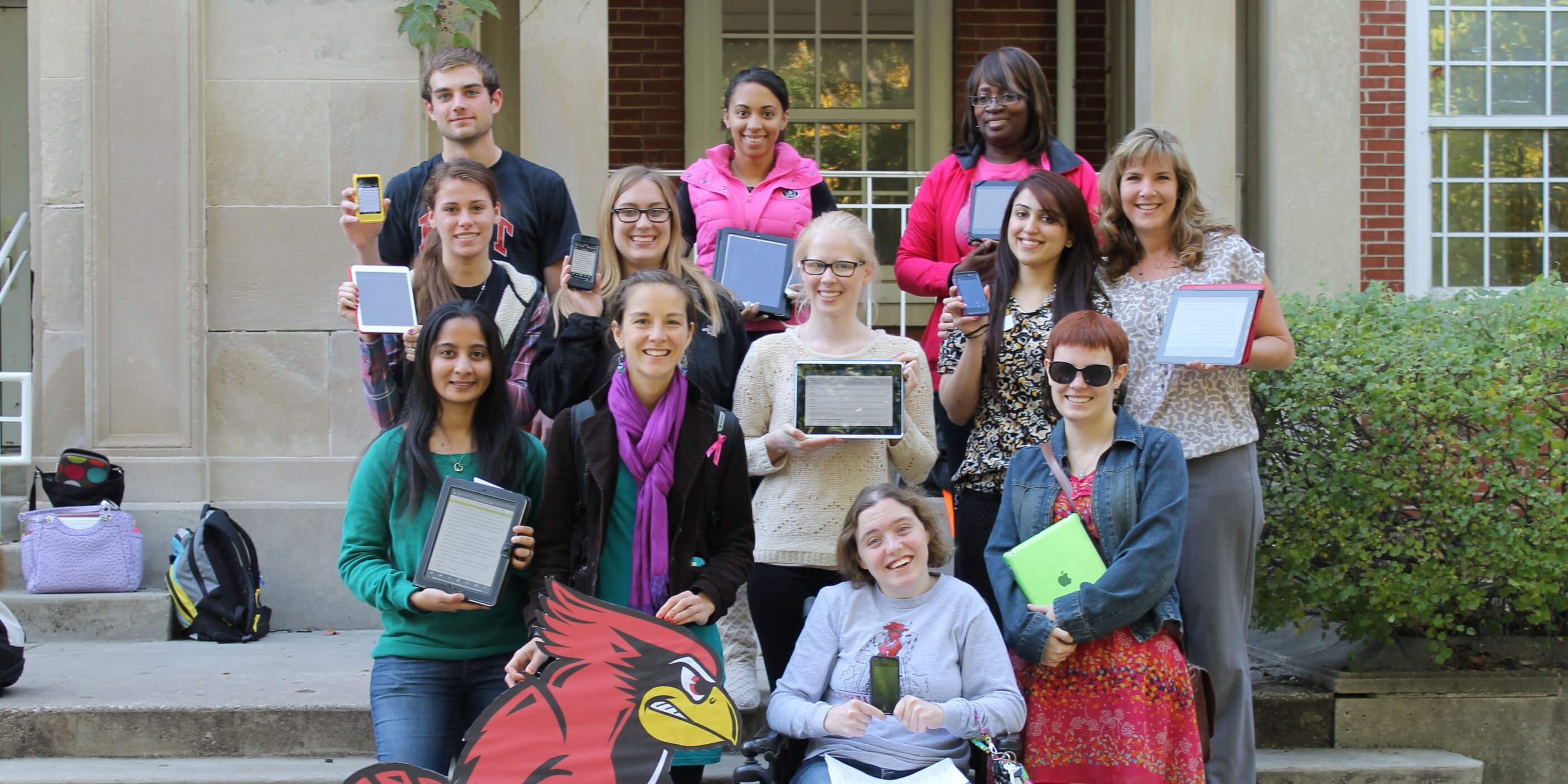 A group of students holding iPads with their Voice Dream Reader Apps.